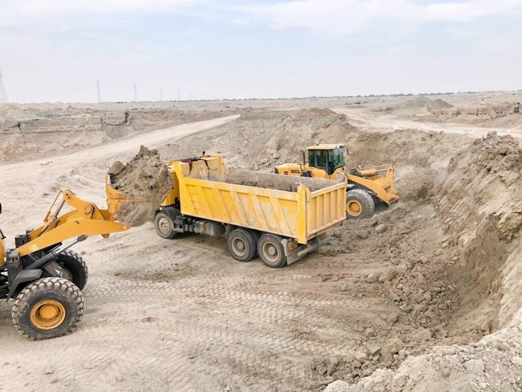 Excavators and Truck with Sand